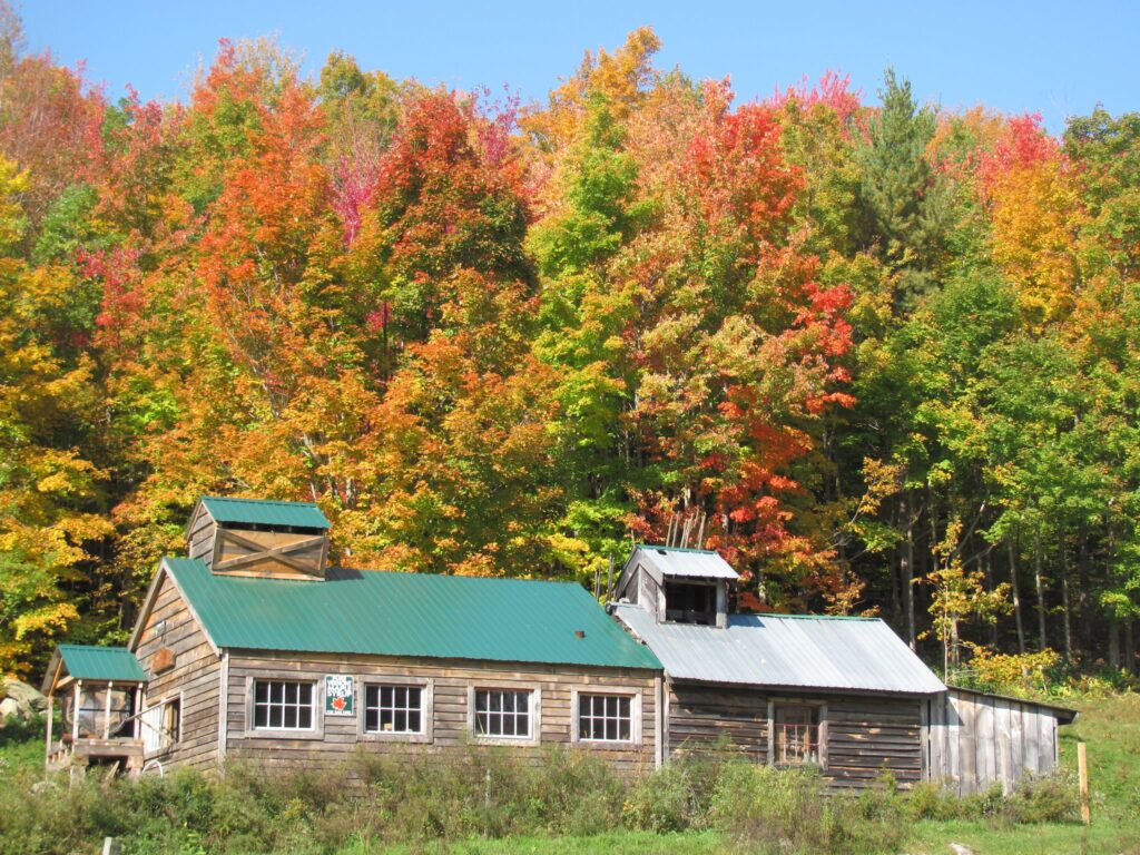 A sugarhouse sits on a hill during a Vermont autumn, enjoying the off time before welcoming Spring. March is maple month in New England.
