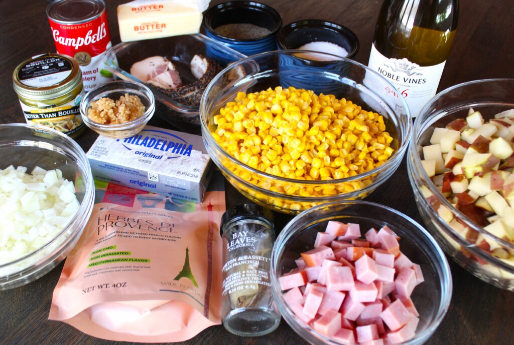 Ingredients for ham potato corn chowder. A comfort food chowder recipe featuring leftover easter ham, pepper bacon, white wine, red potatoes, cream cheese, onion, garlic, herbs de provence and other seasoning. Perfect for a cold early spring evening meal.