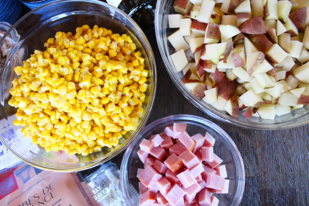 Diced Potatoes, drained sweet whole kernel corn, and diced hickory smoke ham steak are part of the ingredient list for Ham, Potato and Corn Chowder. Perfect for a winter evening, a spring Sunday lunch or as a way to use up leftover Easter ham.