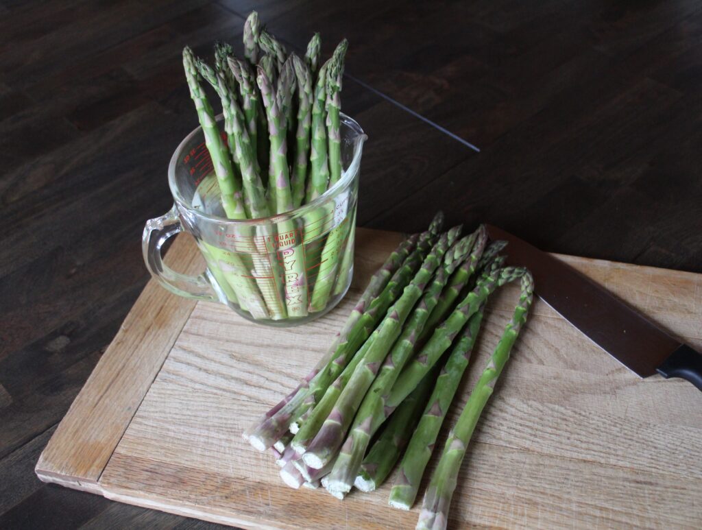 Quick and Delicious Roasted Asparagus, asparagus stalks are being prepped for roasting