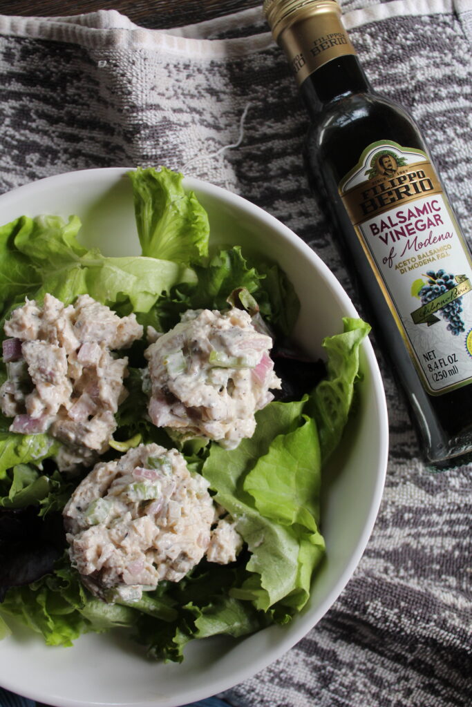 My favorite chicken salad recipe is ready to eat over a crisp bed of lettuce and a drizzle of balsamic vinegar. 